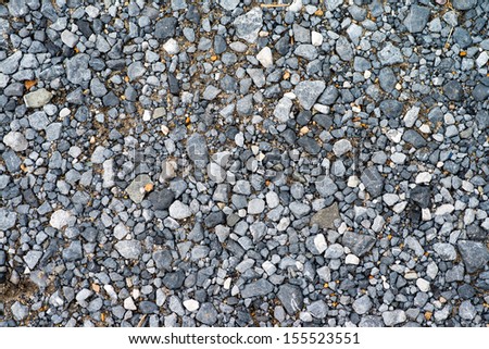 The carpet of crushed granite as background or texture.