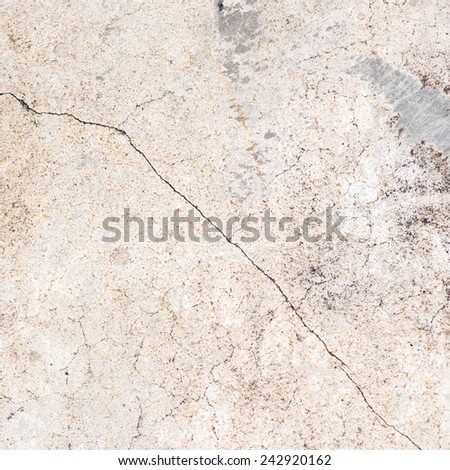 Dirty brown cracked cement floor