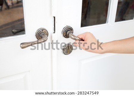 door with a hand on handle