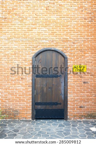 Door on brick wall, side of a house