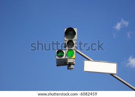 Traffic light with green sign turned on