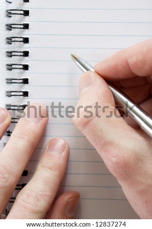 male hand with pen ready for writing