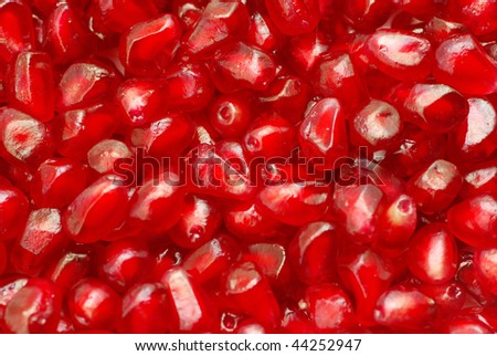 peeled ripe seeds pomegranate background
