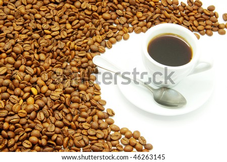 white cup with coffee costing on a coffee grain