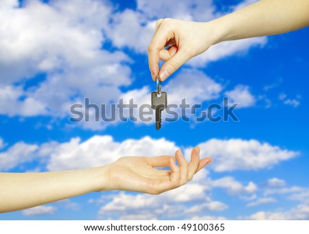 Hands with key