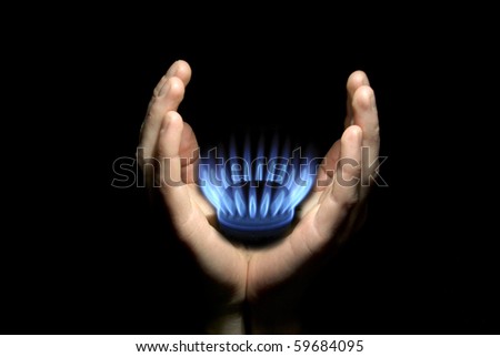 Hands holding a flame gas