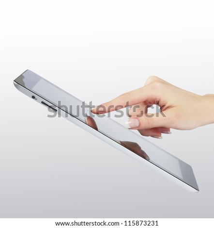 woman hand point on modern electronic digital frame with blank screen woman hand point on modern electronic digital frame with blank screen