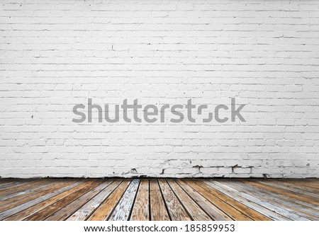 interior room with white brick wall and wooden floor