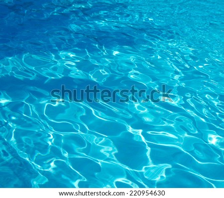 Blue pool water with sun reflections Blue pool water with sun reflections