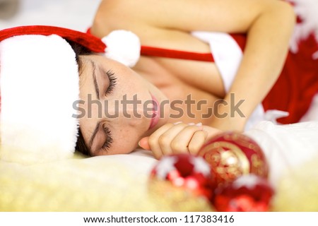 Happy santa claus sleeping in bed