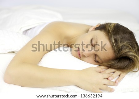 Beautiful blonde woman in bed sleeping strong dreaming happy