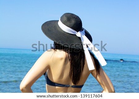 Paradise sea with beautiful back of model/Amazing beauty watching the ocean