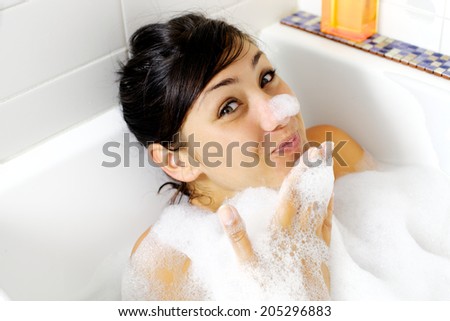 Cute girl smiling with foam on nose