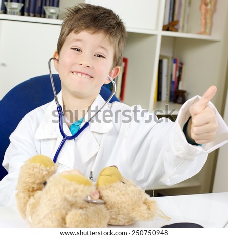 Happy beautiful little boy playing doctor