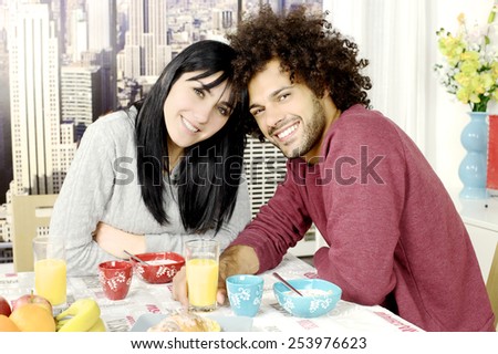 Happy couple in love with cereals fruit and coffee