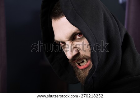 Male vampire ready to attack and eat blood