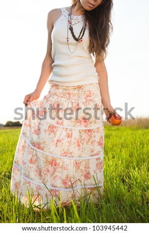 young woman in long skirt and tank top