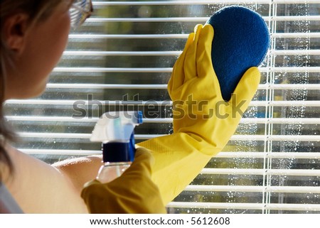 A woman cleaning a window