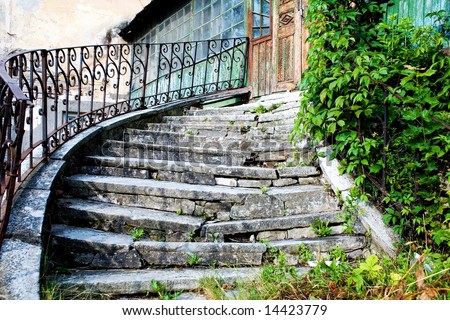Very old stairs hading to old door