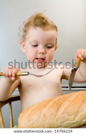 an image of baby-girl eating white bread