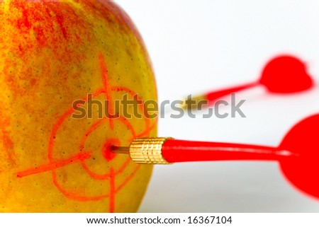 Red-yellow Apple with Darts closeup on White Background