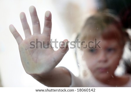 An image of child stands outside the window.