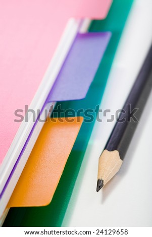 Stock photo: office theme: an image of part of pink notebook and a pencil
