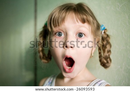 Stock photo: an image of a surprised girl with open mouth