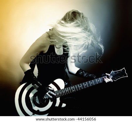 stock photo An image of a young woman with guitar