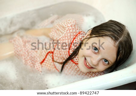 An image of a funny girl in a bath