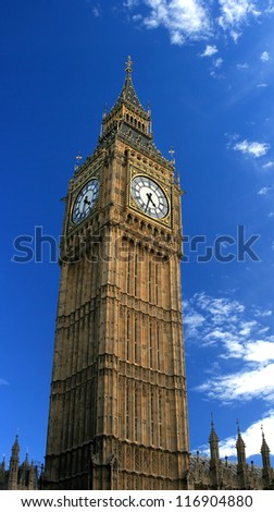 Beautiful details of the Big Ben Tower (London, England) over a blue sky.