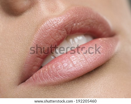 Natural lips. Close up shoot of young beautiful girl with perfect skin: makeup mouth zone. Lips.