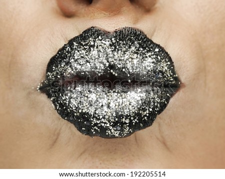 Beauty photograph (close-up) of black shiny female lips.