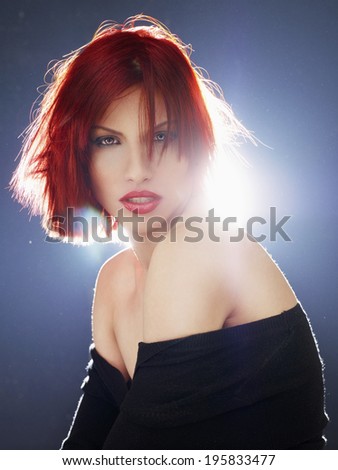 Red Hair. Fashion Woman Portrait. Beauty Model Girl with Luxurious Hair, Make up and Accessories. Hairstyle. Wavy Hair Extensions Concept. Holiday Makeup. Red lipstick