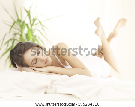 pretty woman laying in bed