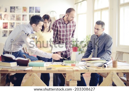 Group Of Architects Having Meeting