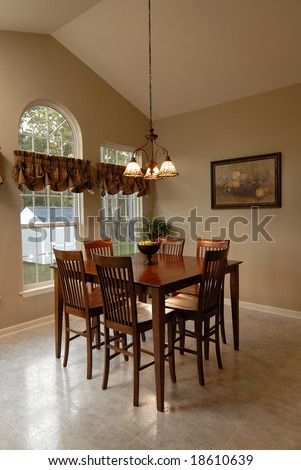 oak dining room tables on Oak Dining Table In Room With Vaulted Ceiling  Stock Photo 18610639