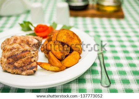 Grilled pork meat with potatoes