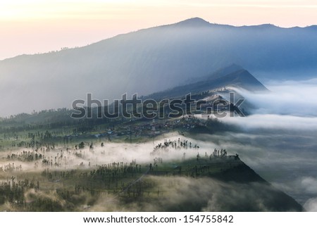 The mist cover the village at Bromo Volcano Mountain in Tengger Semeru National Park, East Java, Indonesia