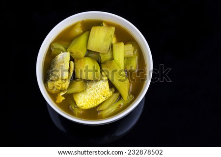 Yellow curry, thai southern style food on black background