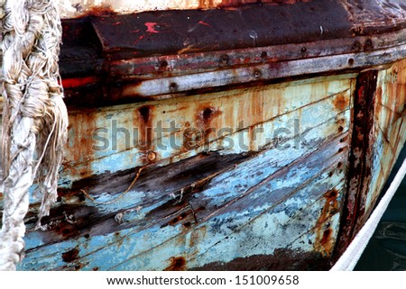 Old boat in the docks of Cape Town harbor.  Rusted, old and in need of repair.  Background.