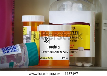 Medicine cabinet with prescription bottles and a prescription of laughter