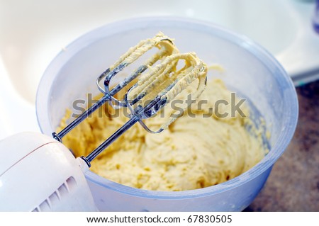 Mixer over bowl of cookie dough