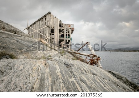 This derelict structure, now abandoned to the elements on a tiny rock outcrop off the Norwegian coast, used to be a shop and rest stop for boats carrying freight up and down the coast.