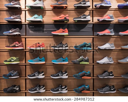 BOLOGNA, ITALY - JUNE 3, 2014: Exposition of nike sport shoes. Nike is one of the world\'s largest suppliers of athletic shoes and apparel. The company was founded on January 25, 1964.