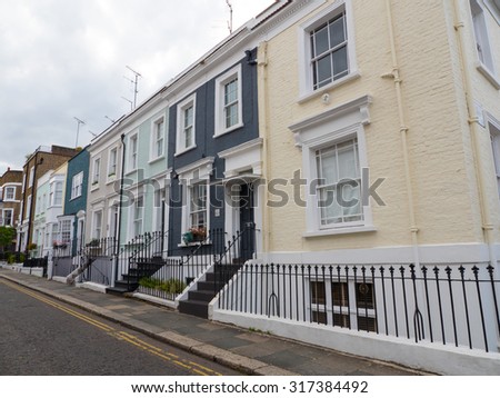 LONDON, UNITED KINGDOM - June 15, 2015: The colourful properties near Portobello Road Market are typical of this vibrant part of Notting Hill, London.