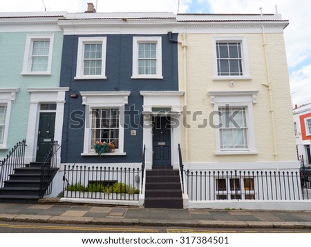LONDON, UNITED KINGDOM - June 15, 2015: The colourful properties near Portobello Road Market are typical of this vibrant part of Notting Hill, London.