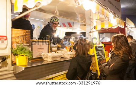 BOLOGNA, ITALY - October 23, 2015: The traditional Italian cuisine on the road. Food served by small trucks around the streets.