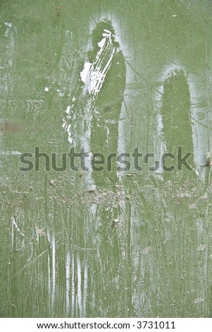 green wall with white paint drips