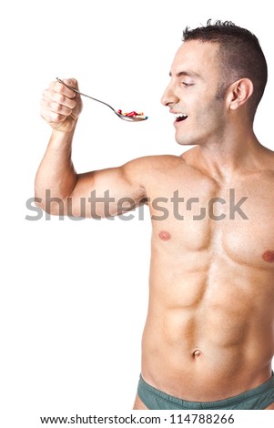 an handsome man taking a spoon full of pills